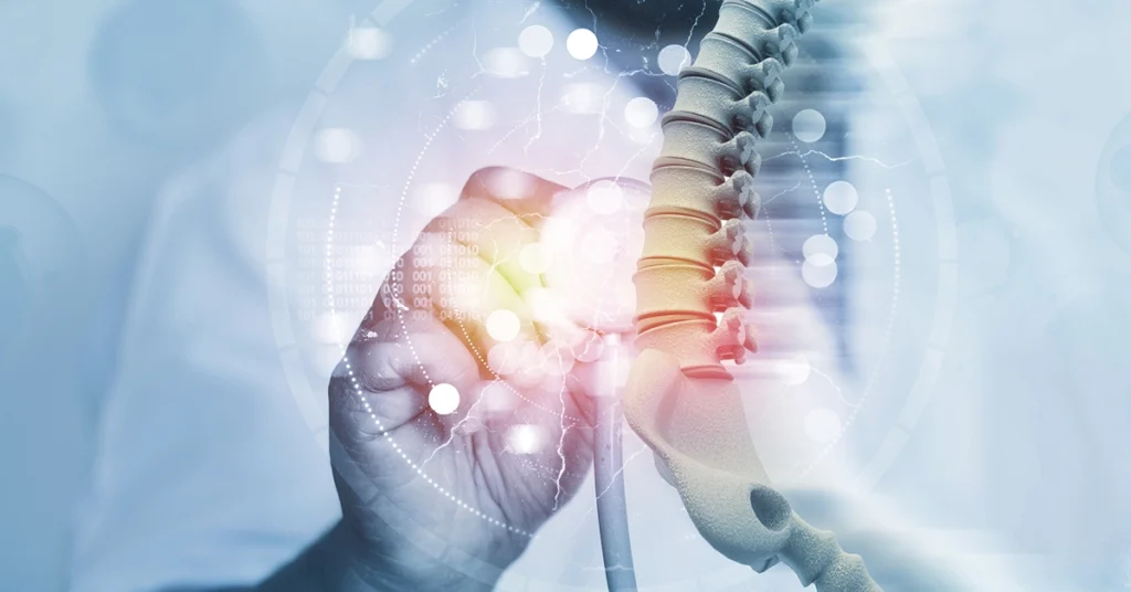 Człowiek przykłada stetoskop do kręgosłupa